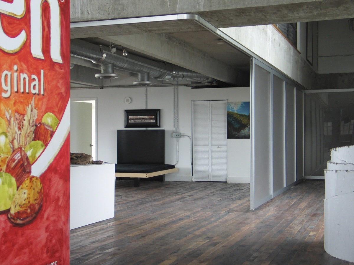 Floor of dining area with Raydoor system installed to preserve open space by eliminating need for floor track