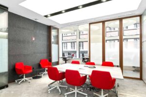 Bright office boardroom lit in part by natural light coming through Raydoor sliding panels