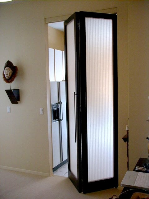 A dark opaque folding end door opened in a home.