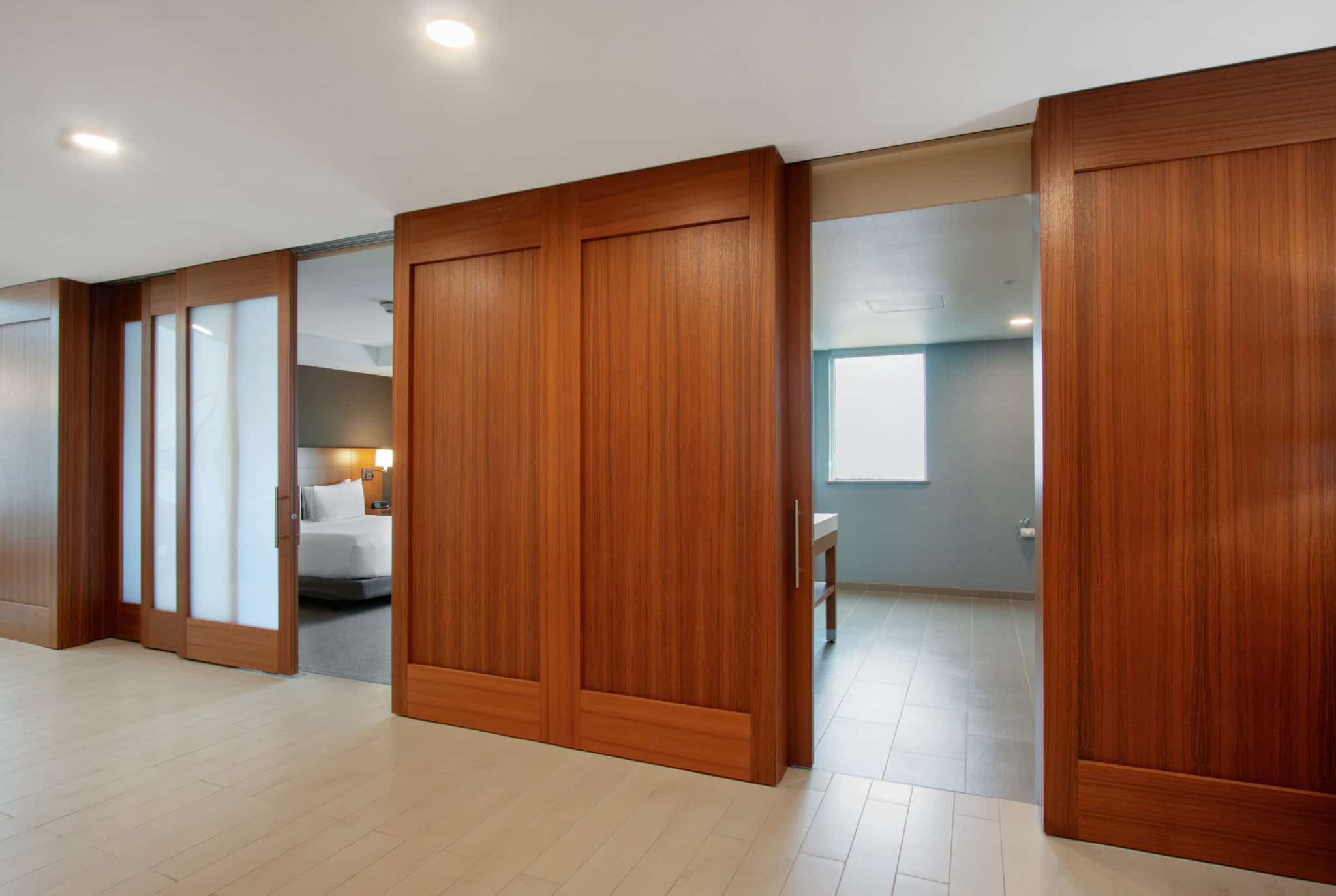 Opaque pocket doors in a hotel partially opened