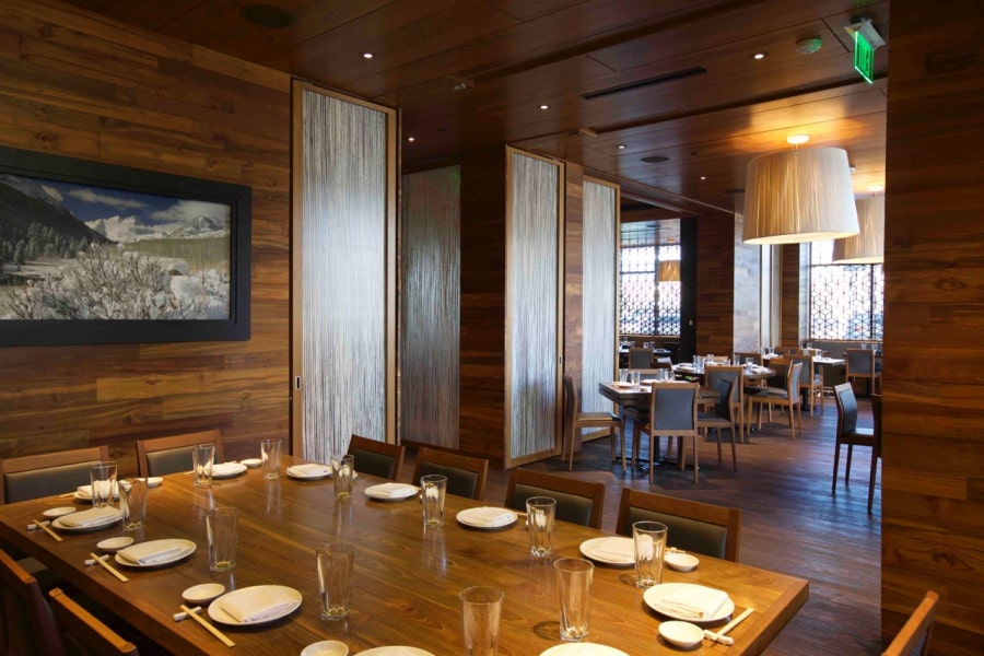 Stacking doors opened in a large dining room in a restaurant
