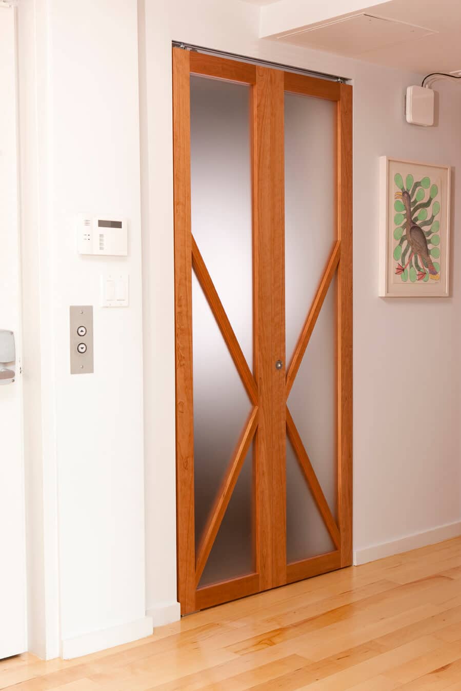 A closed opaque wooden folding door.