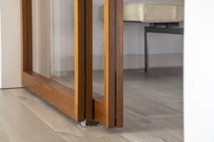 Raydoor sliding door with glass inserts in commercial setting