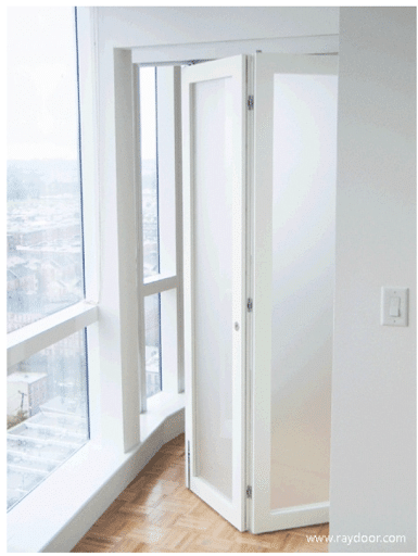 A frosted-panel bifold door keeps the neighboring room private while allowing natural light flow.